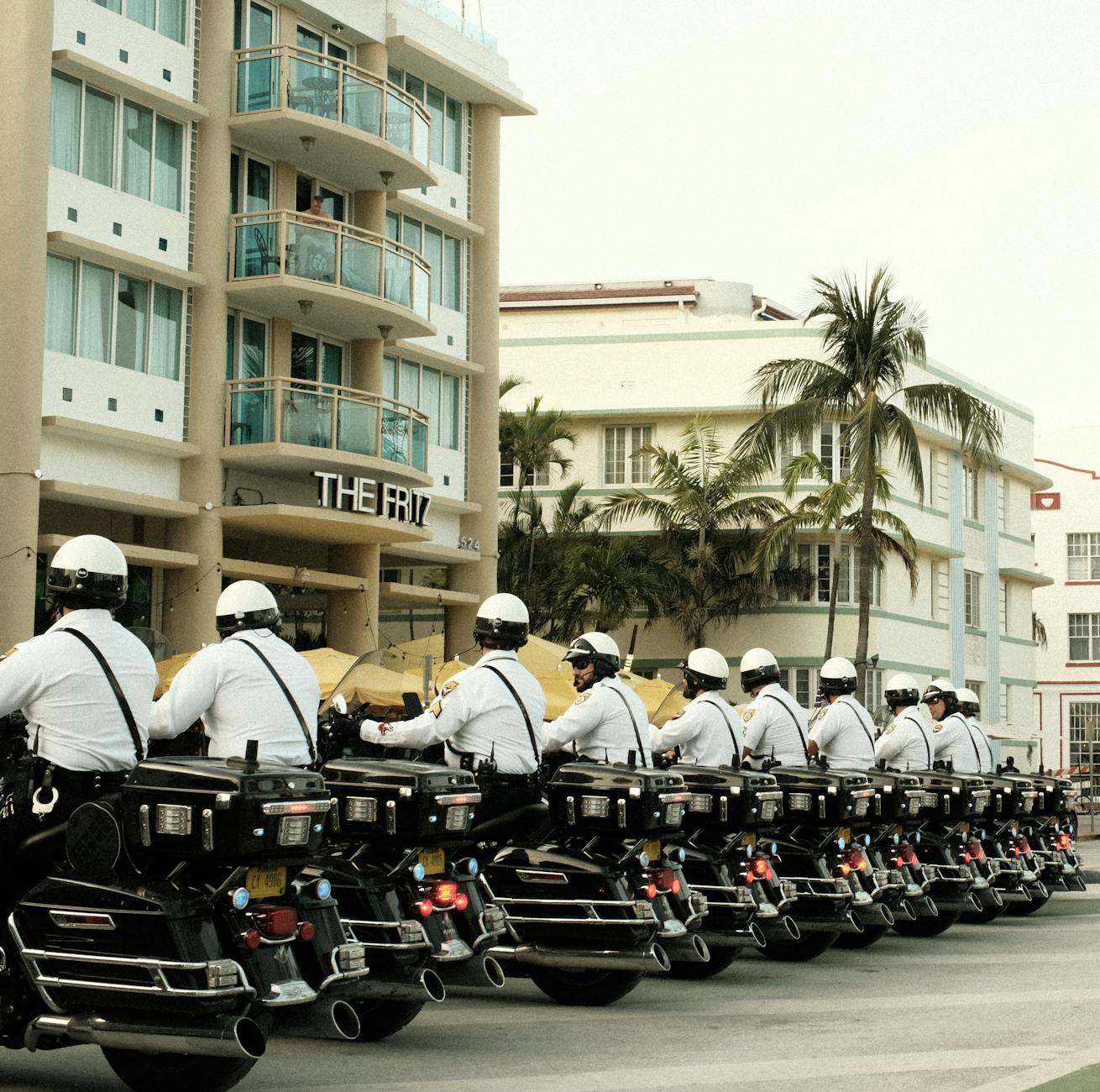 US Secret Service agents surrounding a motorcade at a political event